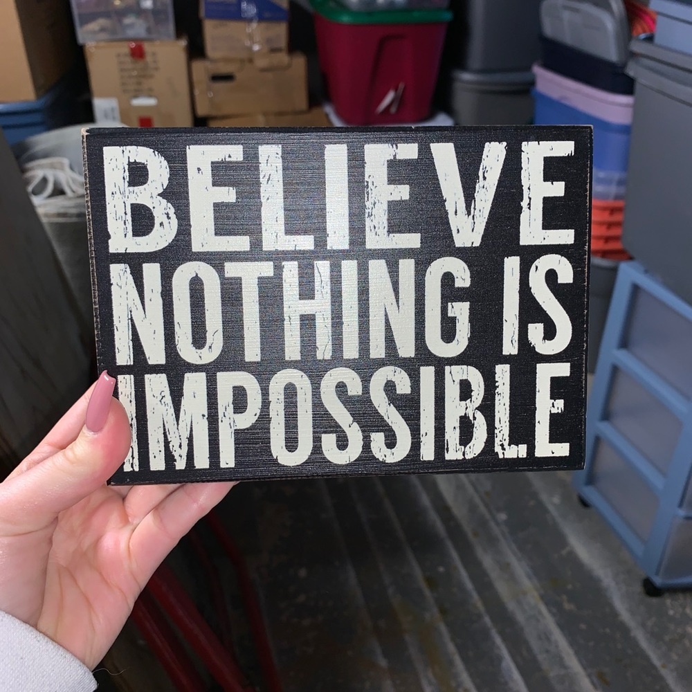 “believe nothing is impossible” wall sign